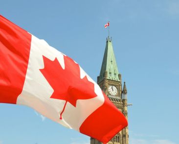 Canada-flag-unsplash-e1762367408896-1536x866